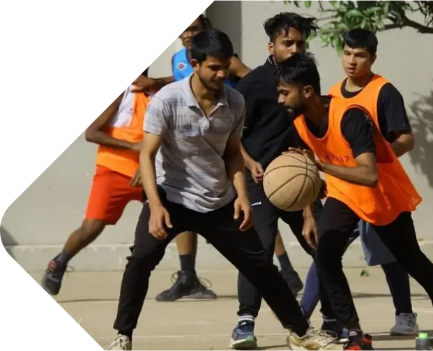 Young men playing basketball outdoors